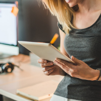 A woman using her tablet device